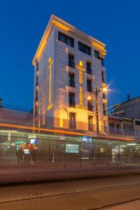 a building with a neon sign on the side of it at World Heritage Center Hotel in Istanbul