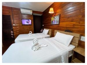 Gulta vai gultas numurā naktsmītnē ข่วงช้างค้ำHotel