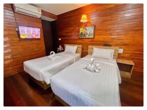 Gulta vai gultas numurā naktsmītnē ข่วงช้างค้ำHotel