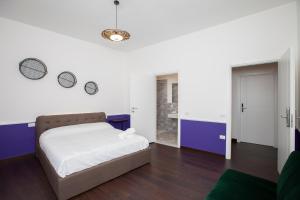 Rúm í herbergi á Myrtus Guest House Cagliari