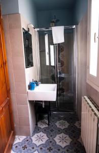 a bathroom with a sink and a shower at Residenza Roma in Pistoia