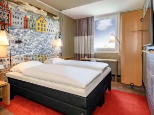 Tempat tidur dalam kamar di ibis Landshut City