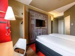 Tempat tidur dalam kamar di ibis Landshut City