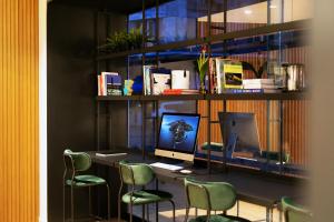 A television and/or entertainment centre at Noa Hotel