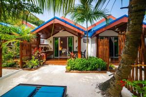 Vrt pred nastanitvijo Beach Villa Ukulhas