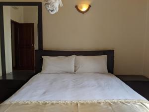 Кровать или кровати в номере Prestige Hotel Suites