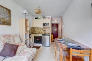 Kuchyňa alebo kuchynka v ubytovaní Le Calao - appartement au Val d'Arly