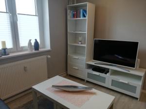 TV tai viihdekeskus majoituspaikassa Apartment mea