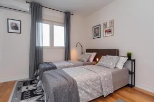 Una cama o camas en una habitación de Les appartements Privés Bar