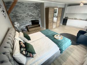 Кровать или кровати в номере Apartament Blue Lagoon