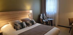 เตียงในห้องที่ Best Western Crequi Lyon Part Dieu