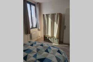 Ένα ή περισσότερα κρεβάτια σε δωμάτιο στο appartement laïs