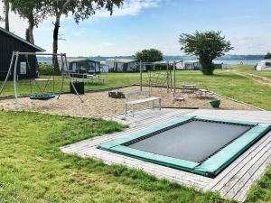 a playground with an empty pool in a park at Two-Bedroom Holiday home in Aabenraa 2 in Aabenraa