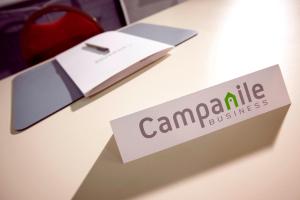 a sign on a table with campeline on it at Campanile Hotel Chantilly in Chantilly