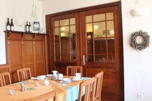 a dining room with a table and a door at Landgasthof Heerlein in Bamberg