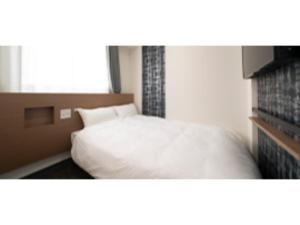 Tempat tidur dalam kamar di R&B Hotel Nagoya Ekimae - Vacation STAY 15184v