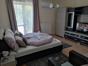 Postel nebo postele na pokoji v ubytování Zsanett Appartement