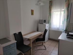 Kuchyň nebo kuchyňský kout v ubytování Zsanett Appartement