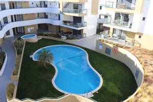 an overhead view of an apartment complex with a swimming pool at ROOF TOP SEA VIEW ALVOR in Alvor