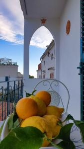 a bunch of fruit sitting on a chair at A Casa di Margy in Ravello