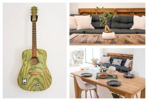 un salon avec une guitare et une salle à manger avec une table dans l'établissement Villa Boho, à Lagos