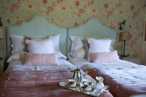 Cama ou camas em um quarto em Helguera Palacio Boutique & Antique