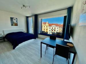 Krevet ili kreveti u jedinici u objektu COZY STUDIO WITH GARAGE IN THE CITY CENTER