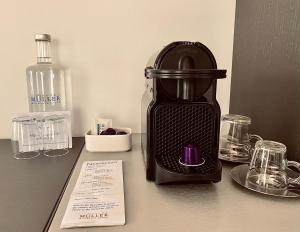 a black blender sitting on top of a counter at Hotel Müller - mountain lodge in Pontresina