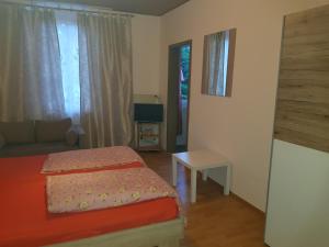 Cama ou camas em um quarto em Pension-Puttlachtal