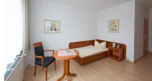 Khu vực ghế ngồi tại Alpha Apparthotel leipzig-Rötha