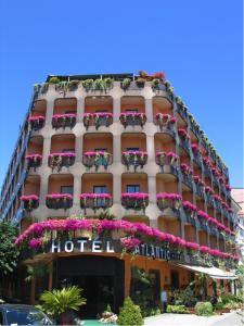 a hotel with flowerpots on the side of a building at Hotel Atlantic in Arona