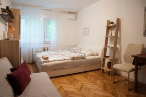 Кровать или кровати в номере Studio Apartment Vijenac