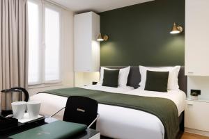 Hotel Brady - Gare de l'Est में एक कमरे में एक या कई बेड