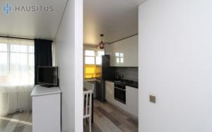 Una cocina o cocineta en Nemuno apartamentai