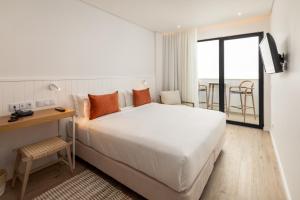 A bed or beds in a room at Pure Formosa Concept Hotel