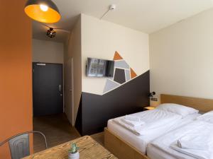 A bed or beds in a room at Five Elements Hostel Leipzig