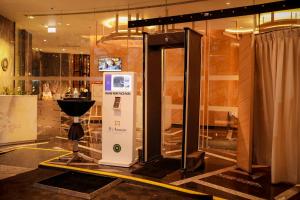 a ticket machine in a room with a display at Welcomhotel by ITC Hotels, RaceCourse, Coimbatore in Coimbatore