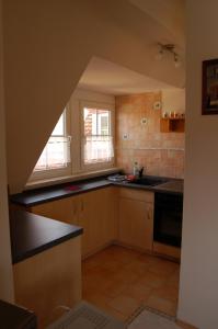 a kitchen with a sink and a window in it at Ferienwohnung Heinrichseck in Bamberg