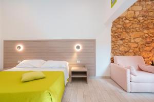 Posteľ alebo postele v izbe v ubytovaní Bardilio Luxury Rooms