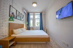 מיטה או מיטות בחדר ב-DayFlat Apartments Olimpiyska Area