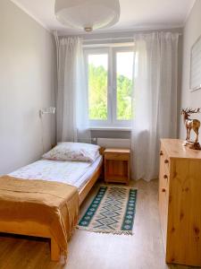 Między górami. Apartament w Cisnej में एक कमरे में एक या कई बेड