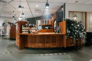 a store with a counter with flowers on it at Hotell Björken in Umeå