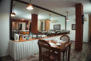 A kitchen or kitchenette at Villa Olympia