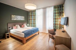 Cama ou camas em um quarto em Hotel Bären am Bundesplatz