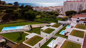 an aerial view of a villa with a garden at Ericeira Prime Villas in Ericeira