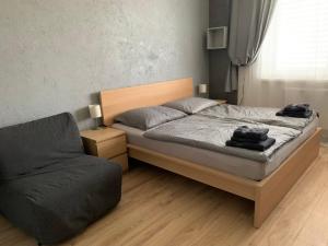 Postel nebo postele na pokoji v ubytování APARTMENTS TRENČÍN