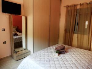 Tempat tidur dalam kamar di Royal Legend Suite