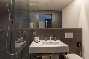 Ένα μπάνιο στο Centurion Swiss Quality Towerhotel Windisch