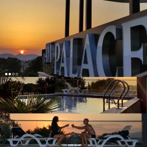 Ein Mann und eine Frau sitzen an einem Tisch vor einem Hotel. in der Unterkunft AM Palace in Ulcinj