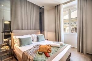 A bed or beds in a room at Hotel 77 Seventy-Seven - Maison D'Art Collection